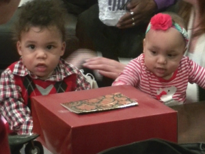 Alexandria and Sebastian with their presents at their first birthday party